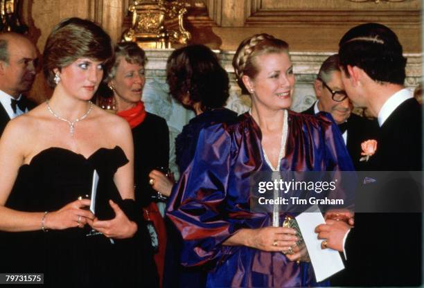 Lady Diana Spencer with Prince Charles, Prince of Wales and Princess Grace of Monaco at Goldsmiths Hall, London, attending a fund-raising concert and...