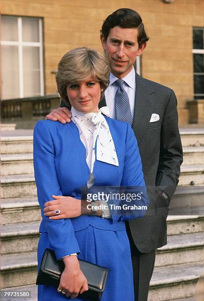 Lady Diana Spencer reveals her sapphire and diamond engagement ring while she and Prince Charles, Prince of Wales pose for photographs in the grounds...