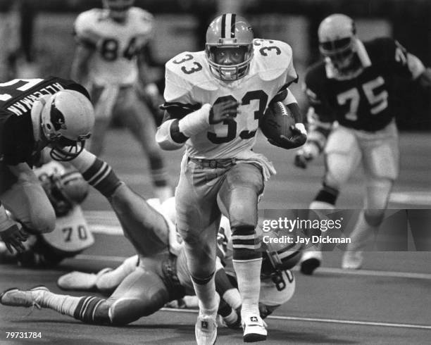 Dallas Cowboys Hall of Fame running back Tony Dorsett tramples everyone on the field as he runs for 102 yards with a 5 and 55 yard touchdowns and...