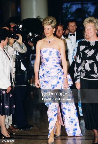 Diana, Princess of Wales at a bicentennial dinner-dance in Melbourne, during a royal tour of Australia, Diana's dress has been designed by Catherine...