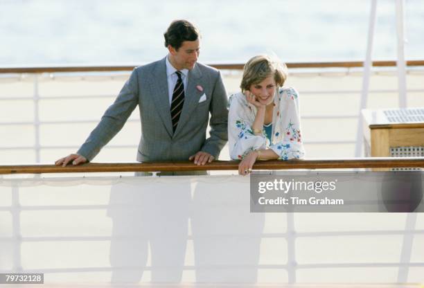 Prince Charles, Prince of Wales with Diana, Princess of Wales on the Royal Yacht Britannia at the start of their honeymoon cruise, Her outfit is...