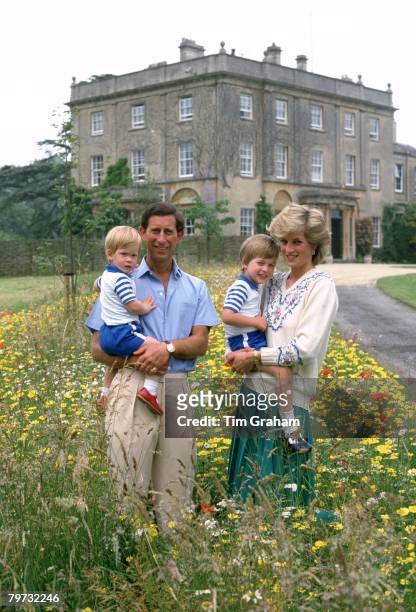 Prince Charles, Prince of Wales and Diana, Princess of Wales with their sons Prince William & Prince Harry in the wild flower meadow at Highgrove