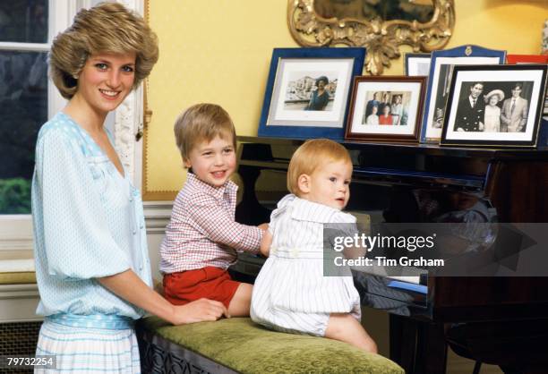 Diana, Princess of Wales with her sons, Prince William and Prince Harry, at the piano in Kensington Palace