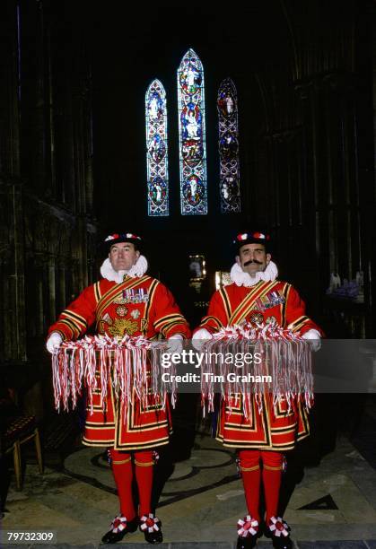 Yeomen of the Guard carry trays of Maundy Money, gifts which the Queen will hand out to pensioners in recognition of their service to the community...