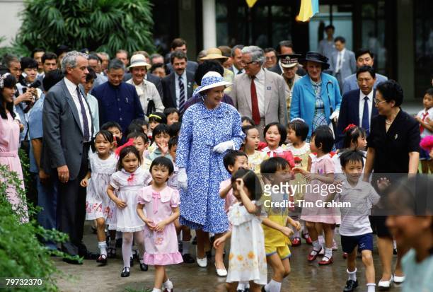 Queen Elizabeth II meets children at the Children's Palace in Canton during a visit to China