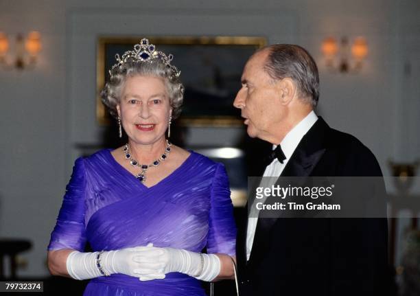 Queen Elizabeth II with President Mitterrand at a banquet on board the Royal Yacht Britannia during her visit to France, The Queen is wearing the...