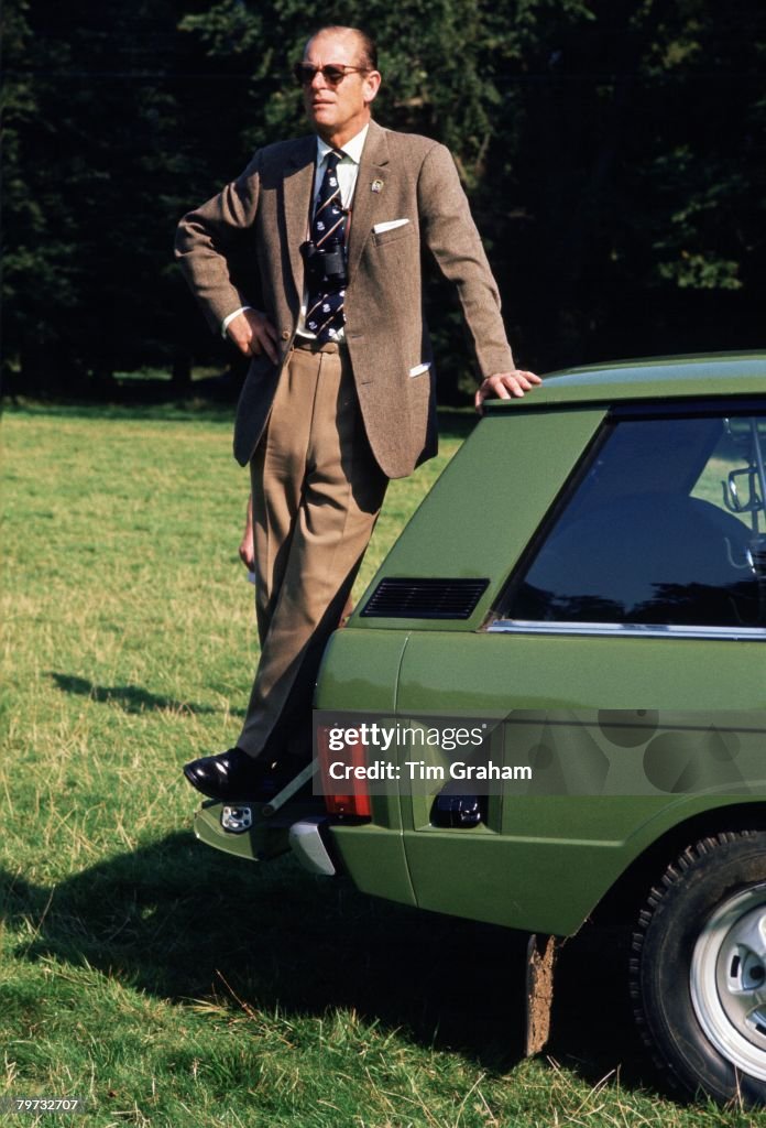 Prince Philip, Duke of Edinburgh, standing on his Range Rove