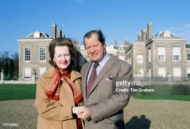 Earl Spencer and his wife Raine in front of their home at Althorpe House