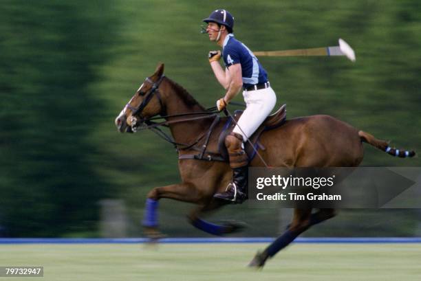 Prince Charles, Prince of Wales playing polo