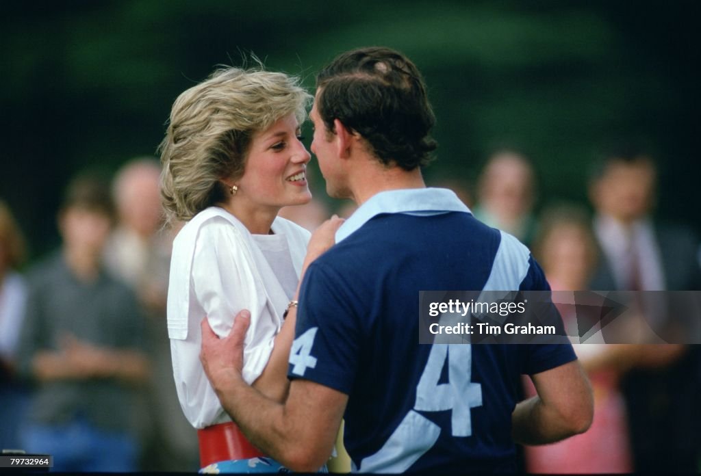 Prince Charles, Prince of Wales kisses Diana, Princess of Wa