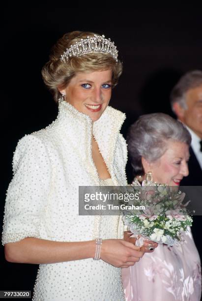 Diana, Princess of Wales wears an outfit described as the 'Elvis dress' designed by Catherine Walker to the Culture Centre in Hong Kong