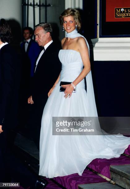 Diana, Princess of Wales at the Theatre Royal Drury Lane for a performance of the musical 'Miss Saigon', Princess Diana is wearing a chiffon dress...