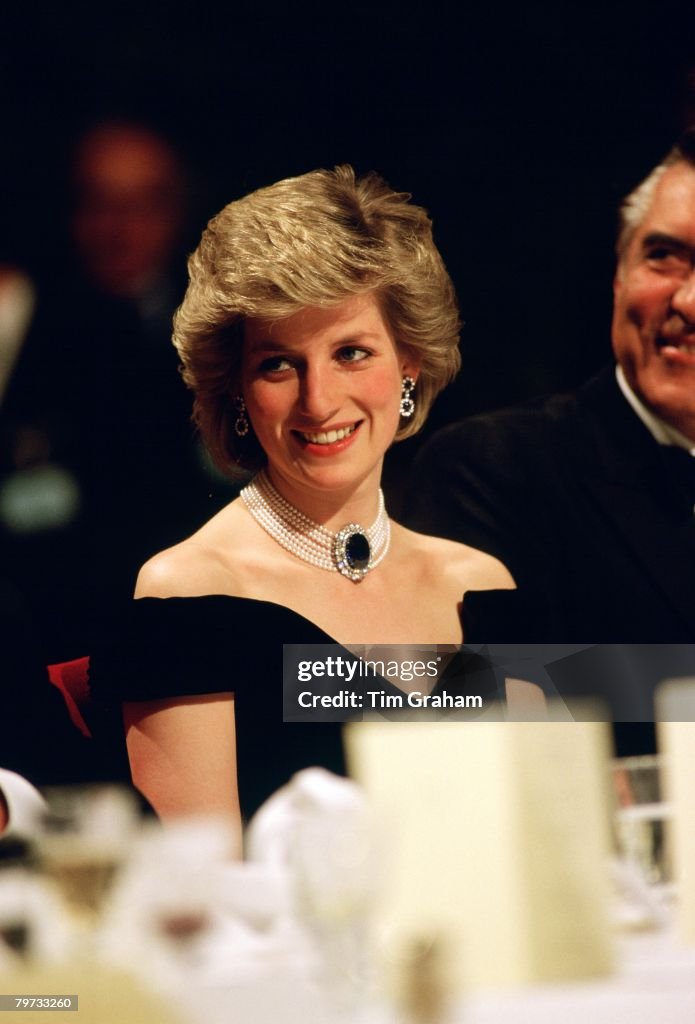 Diana, Princess of Wales wears a sapphire, diamond and pearl