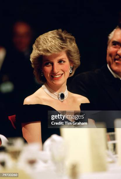 Diana, Princess of Wales wears a sapphire, diamond and pearl choker to a banquet in Vienna