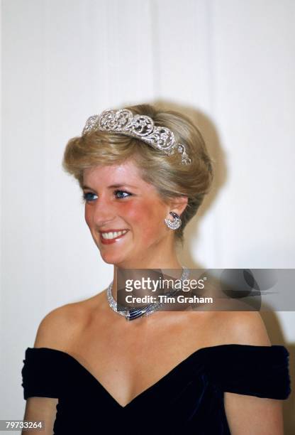 Diana, Princess of Wales wears a diamond and sapphire necklace and the Spencer tiara to a banquet in Germany
