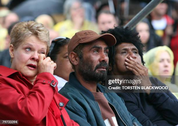 Marcelle Hoff, Michael Kirby and Shireen Malamoo are overcome with emotion as they watch Australian Prime Minister Kevin Rudd on a large screen...