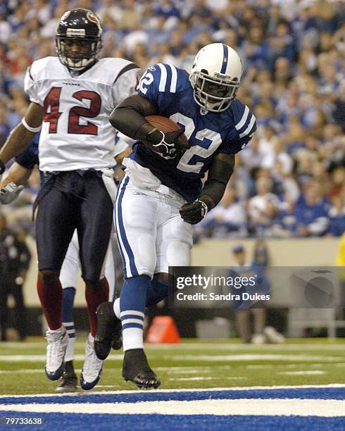 Edgerrin James lands in the end zone for a TD in front of Marcus Coleman in the first quarter of the Colts 31-17 win over the Texans in the RCA Dome...