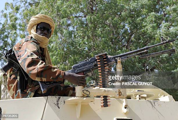 Soldier of the Chadian national army patrols a street on an armored vehicle in front of the Presidential Palace in N'Djamena on February 13, 2008....