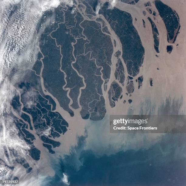 The delta of the River Ganges empties into the Bay of Bengal in Bangladesh, as seen from the space shuttle Atlantis during NASA's STS-66 mission,...