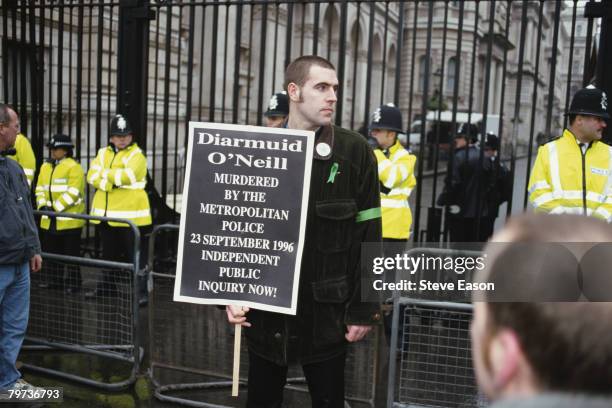 Protester calling for an independent inquiry into the death of IRA volunteer Diarmuid O'Neill during a march to mark the 27th anniversary of Bloody...