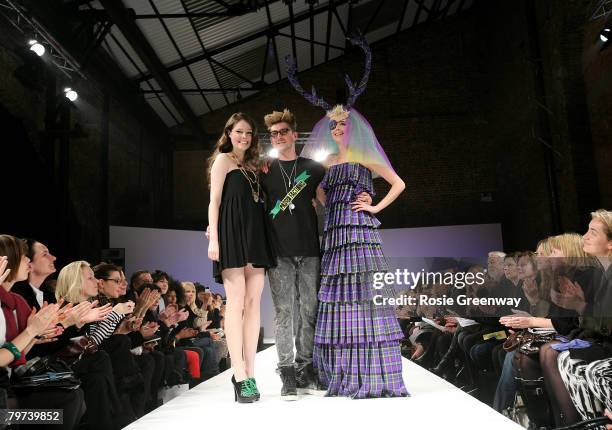 Designer Henry Holland and model Agyness Deyn pose on the runway at the end of the House of Holland LFW Autumn/Winter 2008 show at Village...