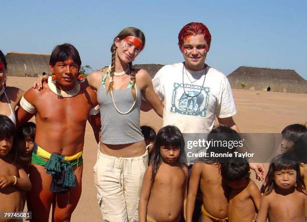 Gisele Bundchen and Leonardo DiCaprio in a cultural exhange visit the Xingu Indians of the Amazon Rainforest. The Xingu Indians are in great danger...