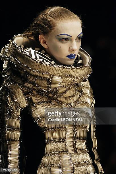 Model walks on the catwalk during the Gareth Pugh show at London Fashion Week, on February 13, 2008. London Fashion Week is now established as one of...