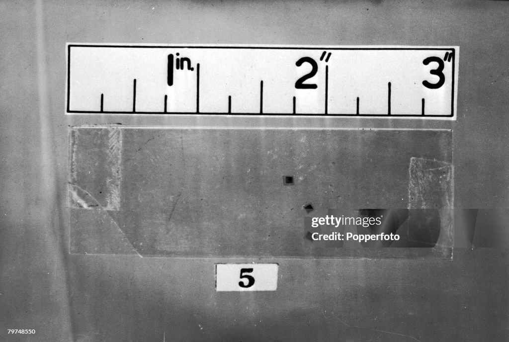Microdote Three Microdots, enlarged 1 and a half times, found in an envelope in ...