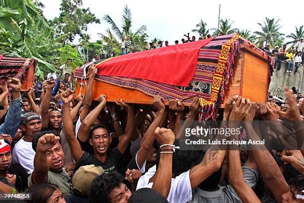 The coffin of rebel leader Alfredo Reinado, who was killed on Monday, is carried before his burial at his home February 14, 2008 in Dili, East Timor....
