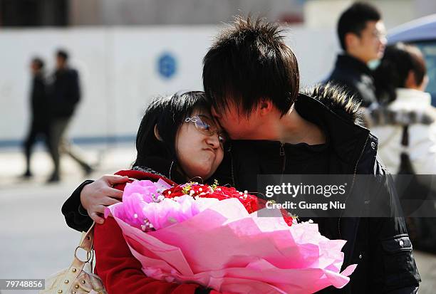 Chinese young lovers share a moment on Valentine's Day February 14, 2008 in Beijing, China. Valentine's Day has become one of the most popular...