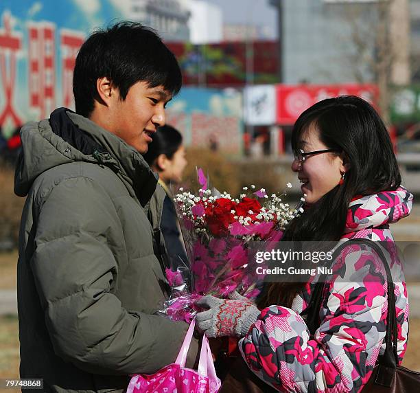 Chinese young lovers share a moment on Valentine's Day February 14, 2008 in Beijing, China. Valentine's Day has become one of the most popular...