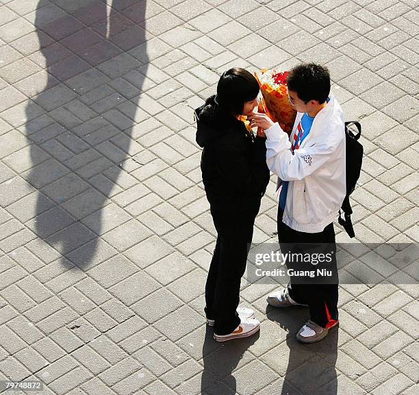 Chinese young lovers share a moment on Valentine's Day February 14, 2008 in Beijing, China. Valentine's Day has become one of the most popular...