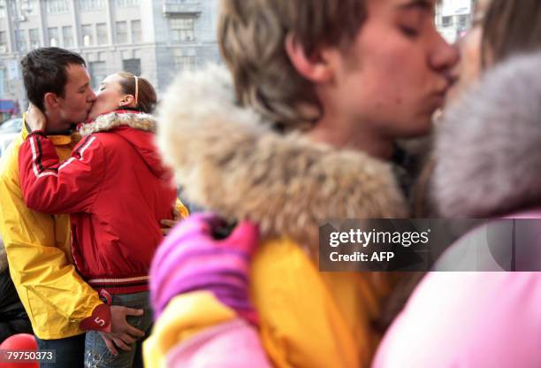 Couples take part in a kissing contest on Valentine's Day in Moscow on February 14, 2008. Valentine's Day is a holiday celebrated on February 14...