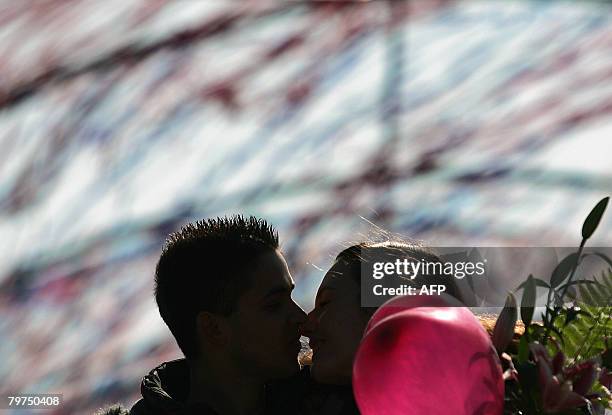 Young couple kisses in downtown Sofia, on February 14, 2008 on Valentine's Day. Valentine's Day is a holiday which dates back from the time of the...