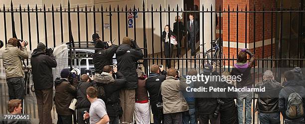 Sir Paul McCartney leaves the High Court by a back door watched by photographers and television crews on February 14, 2008 in London. Sir Paul...