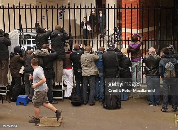 Sir Paul McCartney leaves the High Court by a back door watched by photographers and television crews on February 14, 2008 in London. Sir Paul...