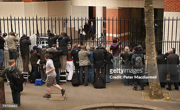 Sir Paul McCartney leaves the High Court by a back door watched by photographers and television crews on February 14, 2008 in London. Sir Paul...