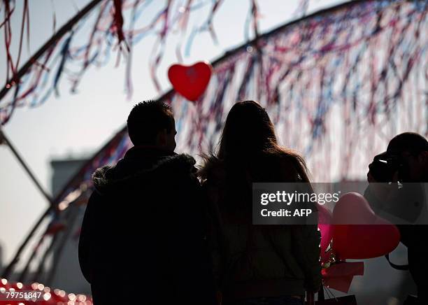 Young couple is seen in downtown Sofia on February 14, 2008 on Valentine's Day. Valentine's Day is a holiday celebrated on February 14 and is known...