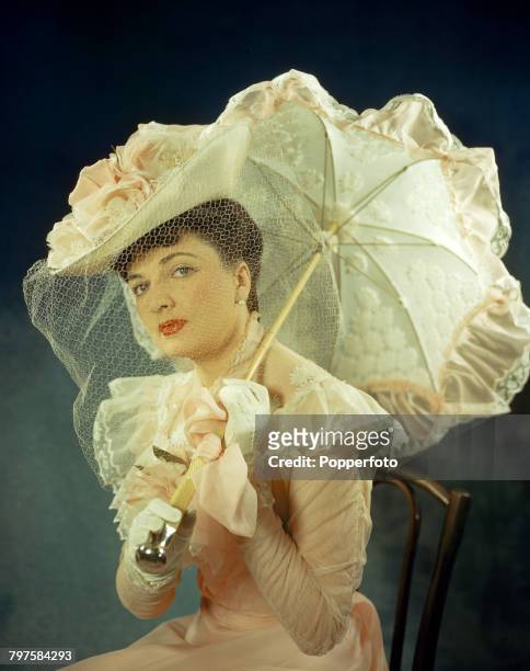 Australian actress Coral Browne pictured in costume as Mrs Cheyney in a production of the play 'The Last of Mrs Cheyney' at the Savoy Theatre in...