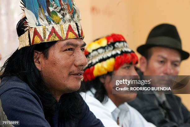 The president of the Waorani indigenous community Enqueri Nihua Ehuenguime speaks next to Domingo Ankuash and Miguel Guatemal during a press...