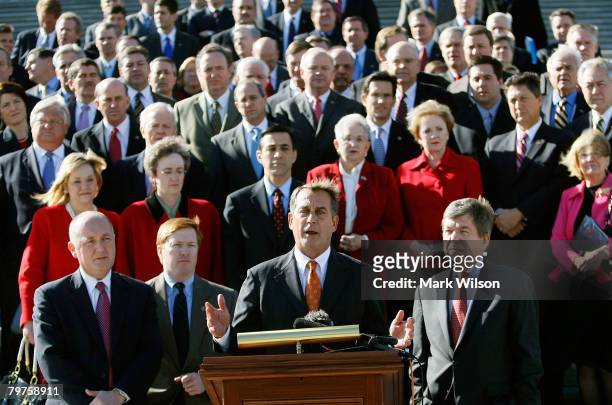 House Republican Leader John Boehner speaks while surounded by House Republicans after walking out of the U.S. Capitol in protest February 14, 2008...