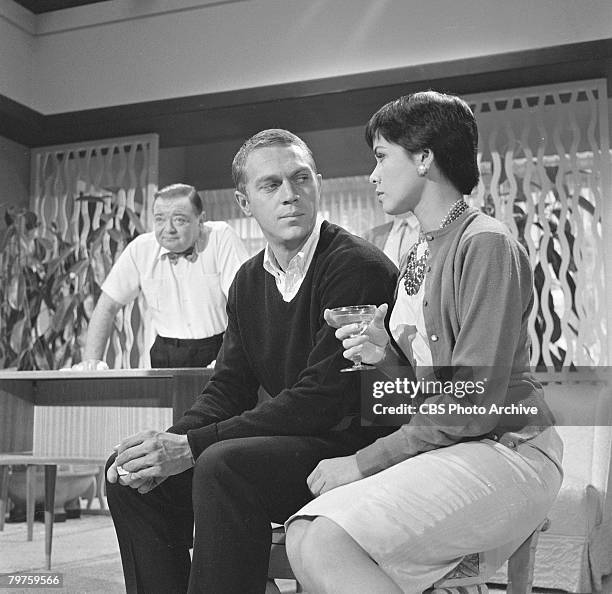 Married American actors Steve McQueen and Neile Adams talk, while Hungarian-born American actor Peter Lorre stands in the background during the...