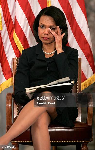 Secretary of State Condoleeza Rice wipes away a tear while attending a memorial service for House Foreign Affairs Chairman Tom Lantos in Statuary...