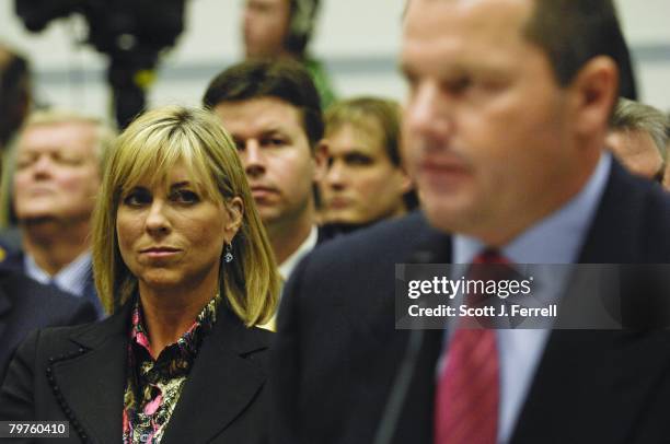 Debbie Clemens, wife of former Major League pitcher Roger Clemens, right, listens as her husband testifies during the House Oversight and Government...