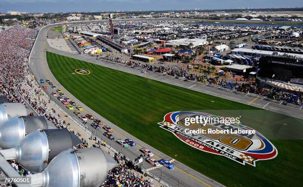 Ryan Newman, driver of the Alltel Dodge, and Joe Nemechek, driver of the Furniture Row Racing Chevrolet, lead the field to the start of the NASCAR...