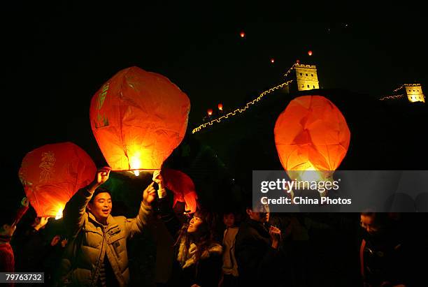 Chinese young lovers fly sky lanterns, or Kongming Lanterns to celebrate the upcoming Valentine's Day at the Foreigners Street on February 14, 2008...