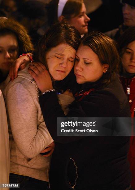 Students gather for a prayer service on the campus of Northern Illinois University to pray for those killed and wounded in yesterday's a shooting at...