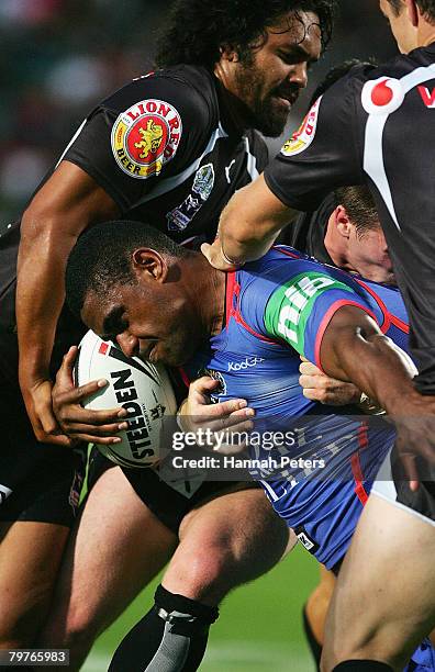 Wes Naiqama of the Knights is caught in tight defence during the NRL trial match between the Warriors and the Newcastle Knights at North Harbour...