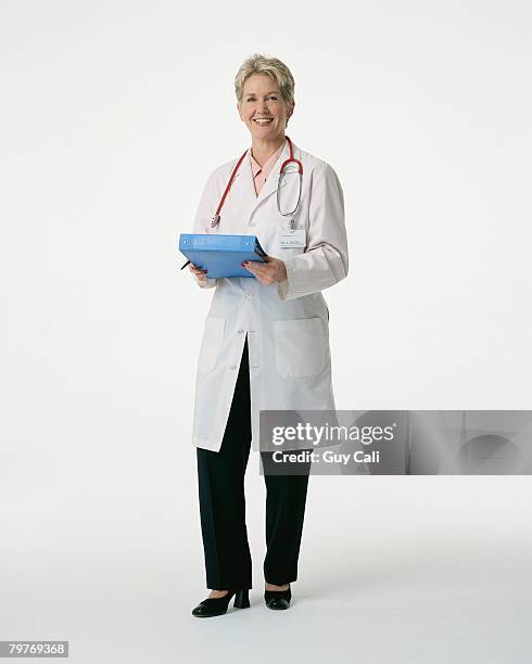 smiling physician wearing a lab coat - cali morales stock pictures, royalty-free photos & images