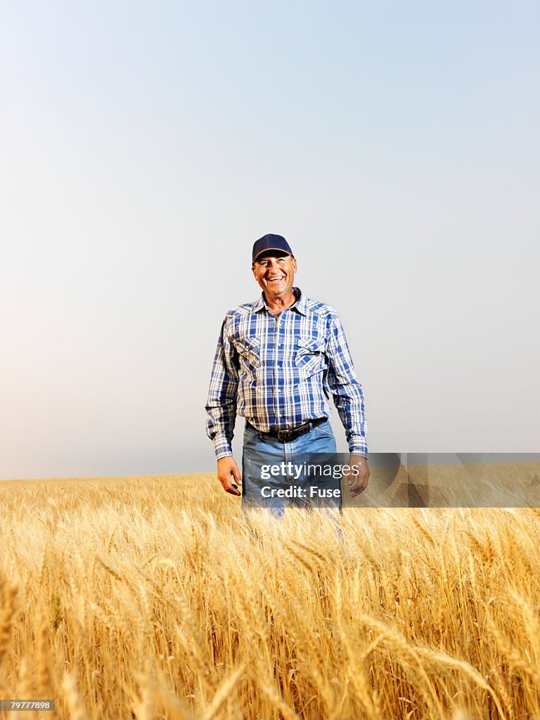 Man Standing in Agricultural Field
